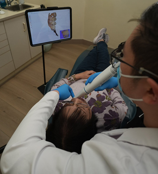Dr. Timothy Loo using digital scanning technology for precise dental care in San Francisco